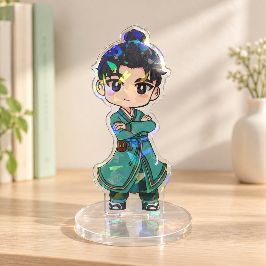 Holographic acrylic character standee with rainbow reflections on a sunlit wooden tabletop